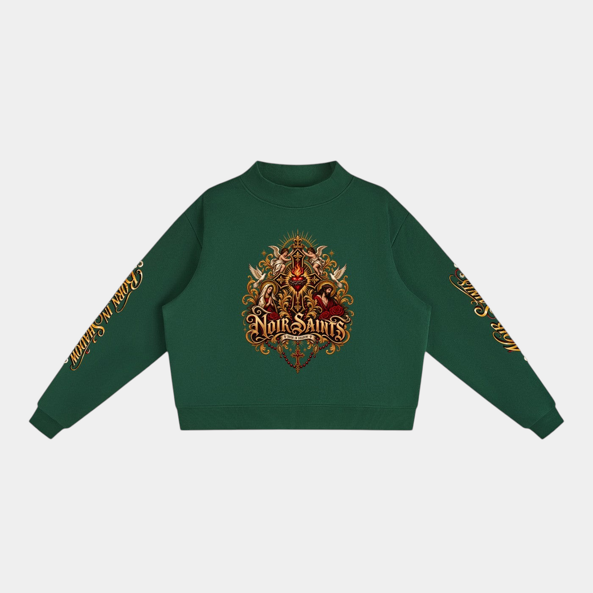 NOIR SAINTS Canada cropped green fleece mock-neck sweatshirt with ornate sacred heart graphic and sleeve lettering.