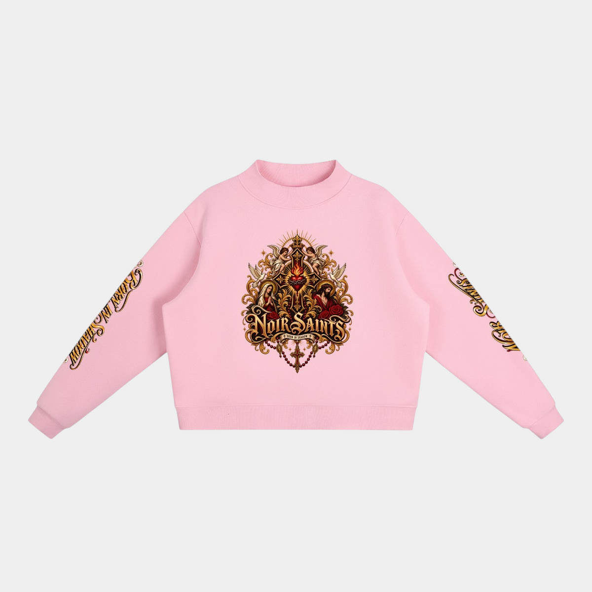 NOIR SAINTS Canada cropped pink fleece mock-neck sweatshirt featuring ornate sacred heart and sleeve graphic details.