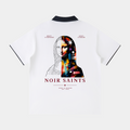 NOIR SAINTS Canada white polo shirt with a split portrait back graphic, contrast collar, and raglan sleeves.