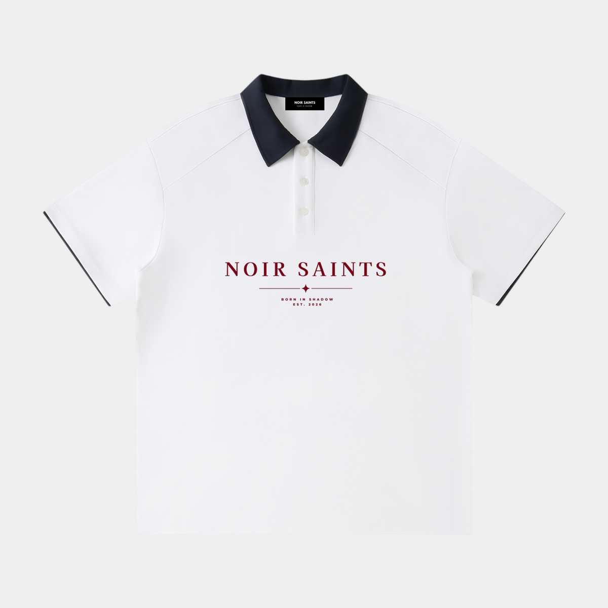 NOIR SAINTS Canada white raglan polo shirt with a black contrast collar and red brand logo graphic on the chest.